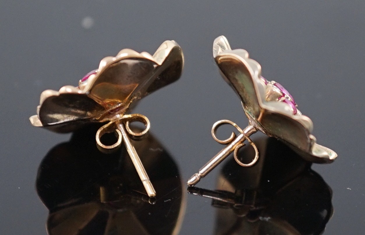 A pair of 1950's gold?, ruby and diamond cluster set flower head earrings